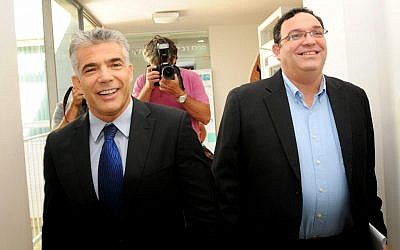 Shai Piron, right, of Yesh Atid, with party leader Yair Lapid in October. Piron's endorsement boosted moderate David Stav in his bid to reform Israel's religious bureaucracy (Photo credit: Ben David/Flash90)