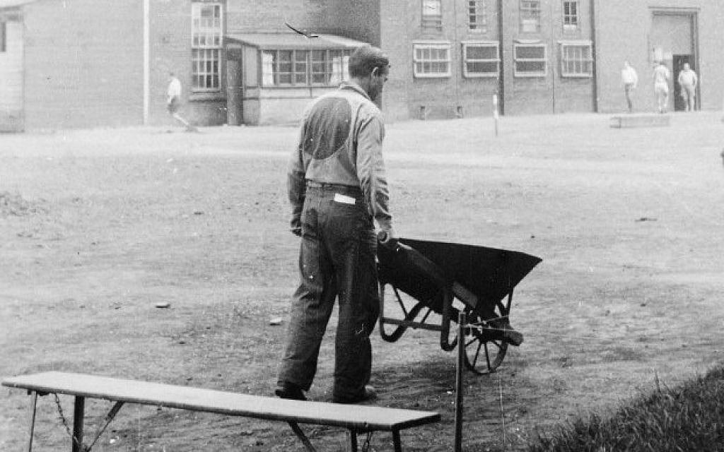 Photograph of an internee in a camp uniform, taken by internee Marcell Seidler, Camp N in Sherbrooke, Quebec, circa 1940-1942. Seidler secretly documented camp life using a handmade pinhole camera. (photo credit: Marcell Seidler/Courtesy Eric Koch/Library and Archives Canada)