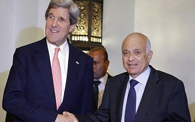 US Secretary of State John Kerry, left, poses for a photograph with Arab League Secretary General Nabil Elaraby, after their meeting in Cairo, Egypt on Saturday. (photo credit: AP Photo/Jacquelyn Martin)
