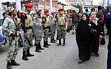 Egyptian army soldiers and military police secure a funeral procession for civilians killed overnight during street battles with police forces, in Port Said, Egypt, Monday, March 4, 2013 (photo credit: AP/Ahmed Ramadan)