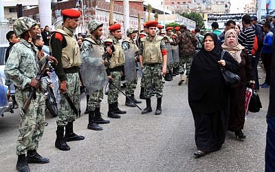 Egyptian army soldiers and military police secure a funeral procession for civilians killed overnight during street battles with police forces, in Port Said, Egypt, Monday, March 4, 2013 (photo credit: AP/Ahmed Ramadan)
