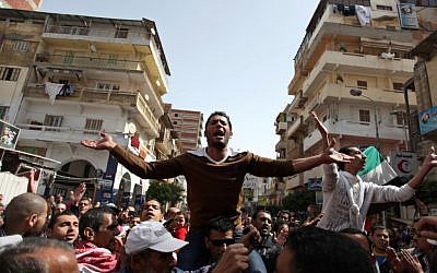Egyptian protesters chant angry slogans during a demonstration after the noon prayer in Port Said, Egypt, Friday, March 8, 2013. With the country in chaos from weeks of protests against the Islamist president, the police have now joined the fray, launching their own protests (photo credit: AP/Khalil Hamra)