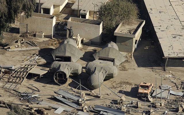 Giant busts of former Iraqi President Saddam Hussein lie in a scrap yard in Baghdad, Iraq,  December. 6, 2011. (photo credit: AP/Hadi Mizban)