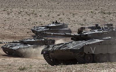 Israeli army tanks participate in a drill near Revivim, southern Israel, Thursday, March 7, 2013 (photo credit: AP/Sebastian Scheiner)