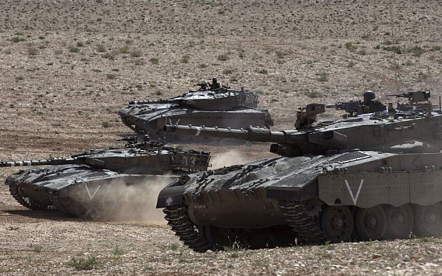 Israeli army tanks participate in a drill near Revivim, southern Israel, Thursday, March 7, 2013 (photo credit: AP/Sebastian Scheiner)