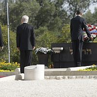 Former US president Barack Obama, right, with then Israeli president Shimon Peres and Prime Minister Benjamin Netanyahu, at the grave of Theodor Herzl during Obama's visit to Mt. Herzl in Jerusalem, Friday, March 22, 2013. (AP Photo/Pablo Martinez Monsivais)