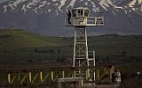 A United Nations Disengagement Observer Force (UNDOF) peacekeeper on a watch tower at the Quneitra Crossing between Syria and Israel. (Ariel Schalit/AP)