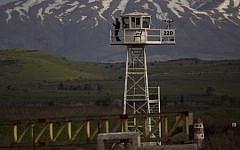 A United Nations Disengagement Observer Force (UNDOF) peacekeeper on a watch tower at the Quneitra Crossing between Syria and Israel. (Ariel Schalit/AP)