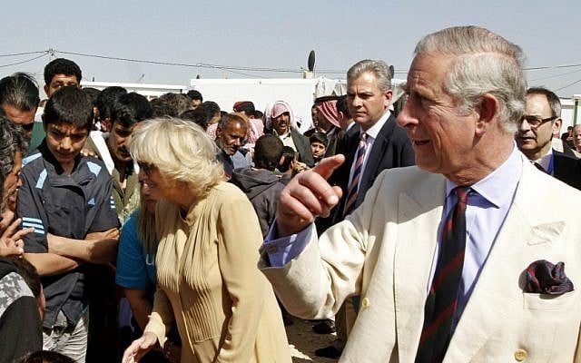 Britain's Prince Charles, right, and his wife Camilla Parker-Bowles, the Duchess of Cornwall, speak to Syrian refugees during their visit to the King Abdullah Park for Syrian Refugees in Ramtha city north of Amman, Jordan. (photo credit: AP/Jamal Nasrallah) Britain's Prince Charles, right, and his wife Camilla Parker-Bowles, the Duchess of Cornwall, speak to Syrian refugees during their visit to the King Abdullah Park for Syrian Refugees in Ramtha city north of Amman, Jordan. (photo credit: AP/Jamal Nasrallah)