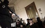 An instructor teaches Syrian rebels to use a rocket-propelled grenade launcher near Idlib, Syria, in March 2013. (photo credit: AP/Muhammed Muheisen)