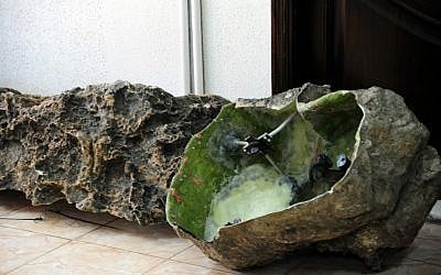 Photo released by the Syrian official news agency SANA showing devices that appear to be like rocks that were found in country’s coastal region, northwest of Damascus. (AP Photo/SANA)