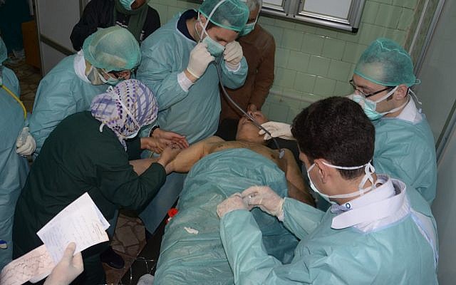 Illustrative photo: A Syrian victim who suffered an alleged chemical attack at Khan al-Assal village -- according to SANA -- receives treatment by doctors at a hospital in Aleppo, Syria, Tuesday, March 19. (photo credit: AP/SANA) Illustrative photo: A Syrian victim who suffered an alleged chemical attack at Khan al-Assal village -- according to SANA -- receives treatment by doctors at a hospital in Aleppo, Syria, Tuesday, March 19. (photo credit: AP/SANA)