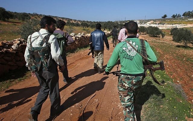 Free Syrian Army fighters move to reconnoiter Syrian army forces, Syria, Wednesday, February, 2013. (photo credit: AP/Hussein Malla) Free Syrian Army fighters move to reconnoiter Syrian army forces, Syria, Wednesday, February, 2013. (photo credit: AP/Hussein Malla)
