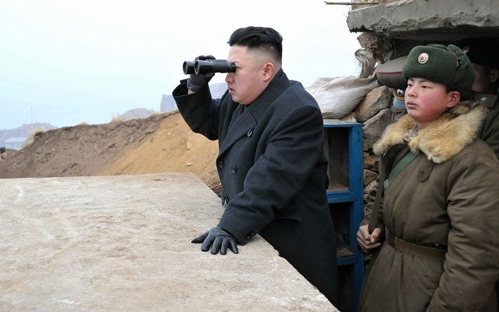 North Korean leader Kim Jong Un uses binoculars to view South Korean territory from an observation post on Jangjae Islet, in March 2013. (photo credit: AP/KCNA via KNS) North Korean leader Kim Jong Un uses binoculars to view South Korean territory from an observation post on Jangjae Islet, in March 2013. (photo credit: AP/KCNA via KNS)