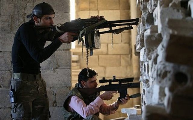 Free Syrian Army soldiers in Idlib province, Syria, in February (photo credit: AP/Hussein Malla) Free Syrian Army soldiers in Idlib province, Syria, in February (photo credit: AP/Hussein Malla)
