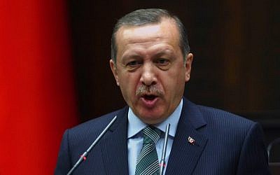 Turkey's Prime Minister Recep Tayyip Erdogan addresses his lawmakers in Ankara, Turkey, Tuesday, March 19 (photo credit: AP)