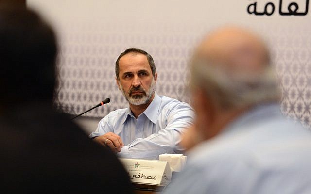 Head of the Syrian National Coalition Moaz al-Khatib speaks during a meeting in Istanbul, Turkey, Monday, March 18, 2013. (photo credit: AP) Head of the Syrian National Coalition Moaz al-Khatib speaks during a meeting in Istanbul, Turkey, Monday, March 18, 2013. (photo credit: AP)