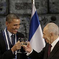 US President Barack Obama and President Shimon Peres toast after Obama receives the Israeli Medal of Distinction from Peres during a state dinner at the presidential residence in Jerusalem, Thursday. (AP Photo/Pablo Martinez Monsivais)