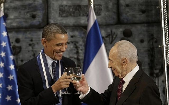 US President Barack Obama and President Shimon Peres toast after Obama receives the Israeli Medal of Distinction from Peres during a state dinner at the presidential residence in Jerusalem, Thursday. (AP Photo/Pablo Martinez Monsivais)
