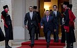 US President Barack Obama walks with Jordan's King Abdullah II to participate in an official arrival ceremony at the Al-Hummar Palace on Friday, March 22, 2013, in Amman, Jordan. (photo credit: AP/Carolyn Kaster)