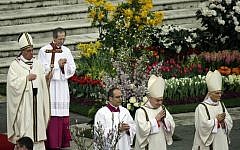 Pope Francis, holding the pastoral staff, celebrates the Easter mass in St. Peter's Square at the Vatican, Sunday, March 31. (photo credit: AP/Gregorio Borgia)