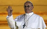 Pope Francis waves to the crowd from the central balcony of St. Peter's Basilica at the Vatican, Wednesday, March 13, 2013. (photo credit: AP/Gregorio Borgia)
