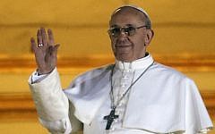Pope Francis waves to the crowd from the central balcony of St. Peter's Basilica at the Vatican, Wednesday, March 13, 2013. (photo credit: AP/Gregorio Borgia)