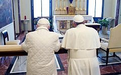 In this photo provided by the Vatican paper L'Osservatore Romano, Pope Francis, right, and Pope emeritus Benedict XVI pray together in Castel Gandolfo Saturday. (AP Photo/Osservatore Romano, HO)