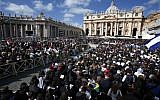 File: Crowds gather in St. Peter's Square for the inauguration Mass for Pope Francis at the Vatican, Tuesday, March 19, 2013. (photo credit: AP/Michael Sohn)
