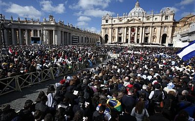 File: Crowds gather in St. Peter's Square for the inauguration Mass for Pope Francis at the Vatican, Tuesday, March 19, 2013. (photo credit: AP/Michael Sohn)