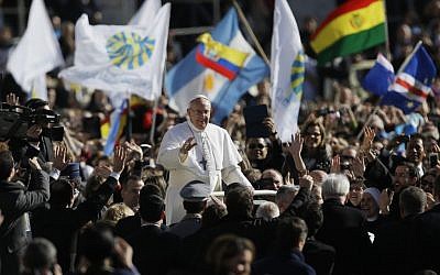Pope Francis waves to crowds as he arrives at his inauguration Mass in St. Peter's Square at the Vatican, on Tuesday, March 19, 2013. (photo credit: AP Photo/Gregorio Borgia)