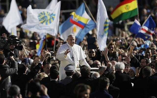 Pope Francis waves to crowds as he arrives at his inauguration Mass in St. Peter's Square at the Vatican, on Tuesday, March 19, 2013. (photo credit: AP Photo/Gregorio Borgia) Pope Francis waves to crowds as he arrives at his inauguration Mass in St. Peter's Square at the Vatican, on Tuesday, March 19, 2013. (photo credit: AP Photo/Gregorio Borgia)