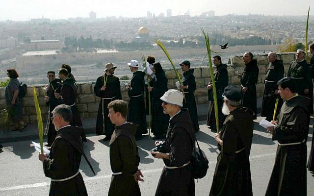 Catholic priests carrying palm fronds to  commemorate Palm Sunday on Jerusalem's Mount of Olives (illustrative photo: Pierre Terdjman/Flash90).