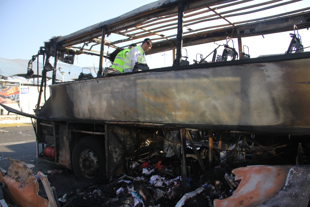 An Israeli emergency rescue team examines the remains of a bus bombed in Bulgaria in July, 2012, allegedly by Hezbollah (Dano Monkotovic/Flash90/JTA) An Israeli emergency rescue team examines the remains of a bus bombed in Bulgaria in July, 2012, allegedly by Hezbollah (Dano Monkotovic/Flash90/JTA)