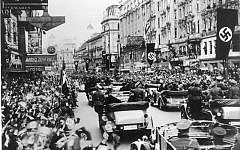 Cheering crowds in Austria welcoming Hitler in 1938. (photo credit: CC BY-SA German Federal Archives. Wikimedia commons)