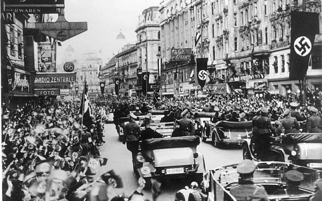 Cheering crowds in Austria welcoming Hitler in 1938. (photo credit: CC BY-SA German Federal Archives. Wikimedia commons)