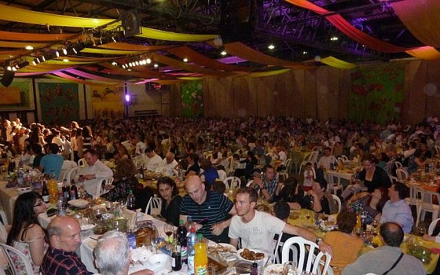 Full tables at Kibbutz Naan on Seder night (photo credit: Courtesy Raaya Ben-Avraham)