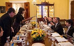 US President Barack Obama and First Lady Michelle Obama seen hosting a previous Passover Seder for family, staff and friends in the Old Family Dining Room of the White House. (Official White House Photo/Pete Souza)