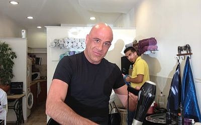 Hair stylist Eli Man likes a blue rinse for gray hair, offering that silvery sheen (photo credit: Jessica Steinberg/Times of Israel)
