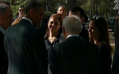President Obama meets with members of the family of the assassinated prime minister Yitzhak Rabin, as Prime Minister Netanyahu and President Peres look on, at Rabin's grave on Friday, March 22 (photo credit: Channel 2 screenshot) President Obama meets with members of the family of the assassinated prime minister Yitzhak Rabin, as Prime Minister Netanyahu and President Peres look on, at Rabin's grave on Friday, March 22 (photo credit: Channel 2 screenshot)