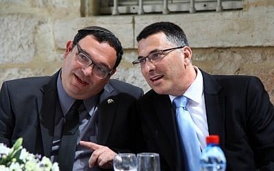 Incoming Education Minister Shai Piron with new Interior Minister Gideon Sa'ar at the Education Ministry ceremony marking the handover. (Photo credit: Sasson Tiram) Incoming Education Minister Shai Piron with new Interior Minister Gideon Sa'ar at the Education Ministry ceremony marking the handover. (Photo credit: Sasson Tiram)