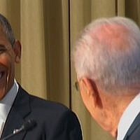 US President Barack Obama smiles at his Israeli counterpart, Shimon Peres, during a joint presentation at the President's Residence in Jerusalem, Wednesday (photo credit: Channel 2)