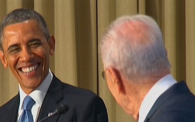 US President Barack Obama smiles at his Israeli counterpart, Shimon Peres, during a joint presentation at the President's Residence in Jerusalem, Wednesday (photo credit: Channel 2)