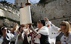 Members of the Women of the Wall wear prayer shawls as they pray at the Western Wall on March 12, 2013. (photo credit: Miriam Alster/Flash90)