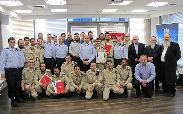 Soldiers, teachers, IAF officials, and rabbis at the MCITP certification graduation ceremony for Haredi soldiers (photo credit: Courtesy) Soldiers, teachers, IAF officials, and rabbis at the MCITP certification graduation ceremony for Haredi soldiers (photo credit: Courtesy)