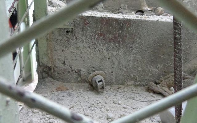 A photo distributed by the Syrian Observatory for Human Rights purportedly depicting the remains of a chemical bomb dropped on a rebel-controlled neighborhood in Aleppo, Syria, Saturday, April 13 (photo credit: Courtesy) A photo distributed by the Syrian Observatory for Human Rights purportedly depicting the remains of a chemical bomb dropped on a rebel-controlled neighborhood in Aleppo, Syria, Saturday, April 13 (photo credit: Courtesy)