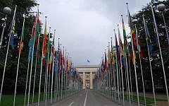 Flags outside the UN's Palais de Nations in Geneva. (photo credit: CC BY kevingessner, Flickr)