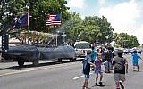 Children playing next to a Guam Liberation Day parade in July last year. (photo credit: Shaina Santos/US Navy)