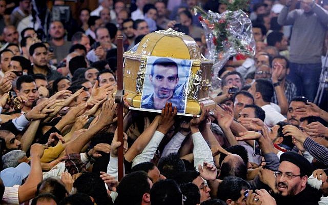 Egyptian Christians carry the coffin of Morqos Kamal, at the Saint Mark Coptic cathedral in Cairo, Egypt, Sunday, April 7, 2013. (photo credit: AP/Amr Nabil) Egyptian Christians carry the coffin of Morqos Kamal, at the Saint Mark Coptic cathedral in Cairo, Egypt, Sunday, April 7, 2013. (photo credit: AP/Amr Nabil)
