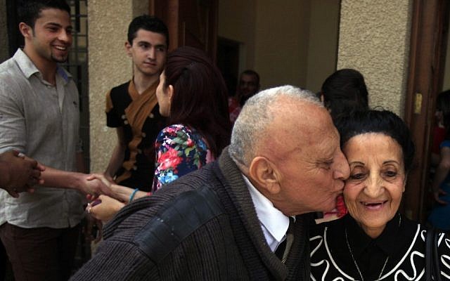 Iraqi Christians congratulate each other after Easter mass at Mar Youssif Chaldean Church in Baghdad on Sunday. (photo credit: AP Photo/ Karim Kadim) Iraqi Christians congratulate each other after Easter mass at Mar Youssif Chaldean Church in Baghdad on Sunday. (photo credit: AP Photo/ Karim Kadim)